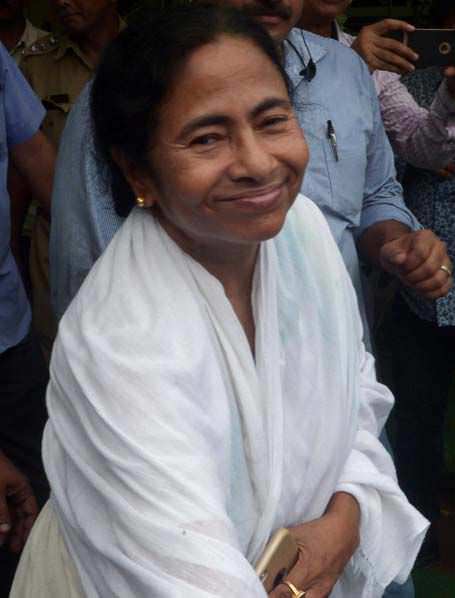 MAMATA BANERJE greeting party workers near her residence on May 19, when the results were announced.