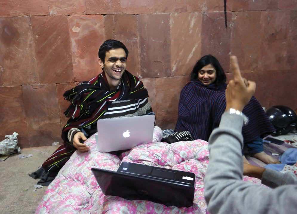Umar Khalid (left) with other students;(right) a campus demonstration on 15 February.